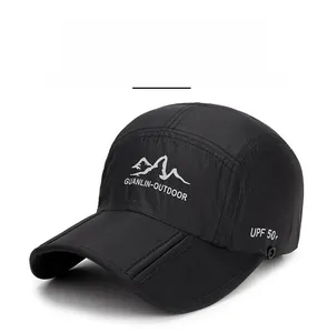 Detail of black quick-dry outdoor cap showing UPF 50 plus sun protection and mountain logo