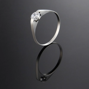 Elegant rose gold titanium steel couple ring with embedded diamond on reflective surface