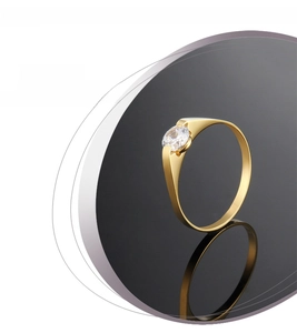 Detail view of rose gold titanium ring with a single sparkling round cut zircon stone