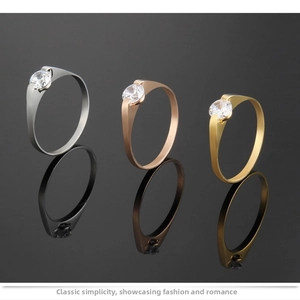 Minimalist titanium steel couple rings in silver, rose gold, and gold with tension set CZ