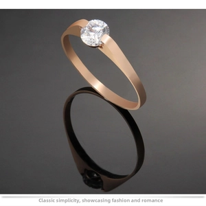 Macro shot of rose gold tension set ring with a brilliant round cut solitaire diamond