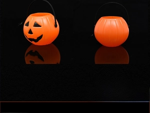Side and back view of orange Halloween pumpkin buckets with black plastic handles