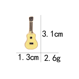 Macro view of guitar enamel pin with dimensions 3.1x1.3cm and 2.6g weight metrics