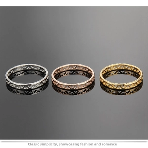 Detailed view of hollow heart pattern rings in silver, rose gold and gold finishes