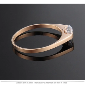 Detailed view of rose gold titanium steel ring with minimalist solitaire stone setting