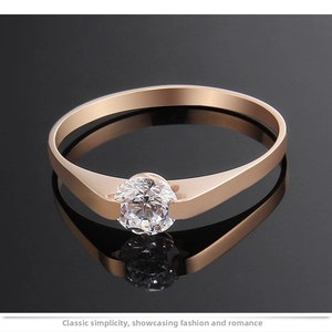 Detailed close-up of a rose gold titanium steel ring with a brilliant tension-set solitaire diamond