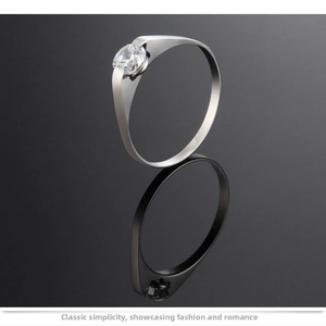Macro shot of silver titanium ring featuring a tension-set round cubic zirconia gem