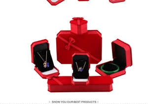 Detailed set of red velvet jewelry boxes featuring necklace, ring and bracelet cases