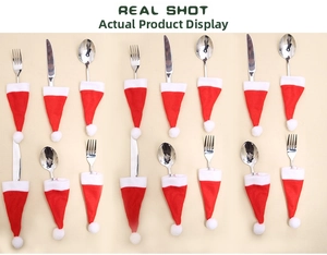 Macro detail of 16 mini red Santa hat cutlery holders made of soft non-woven fabric