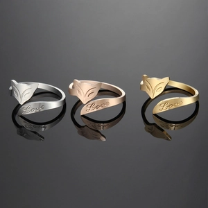 Three fox head open rings in silver rose gold and gold with Love engraving and mirror reflection