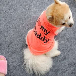 Detail of coral orange dog vest featuring 'I love my Daddy' print and red heart design