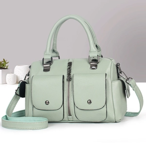 Mint green leather Boston handbag with front pockets and adjustable shoulder strap