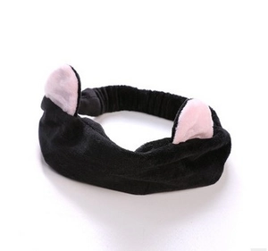 Detail of soft black plush headband featuring cute pink cat ears for face washing