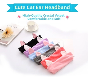 Close-up of soft crystal velvet cat ear headbands in multiple colors on a white desk