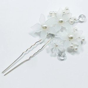 Elegant bridal hair pin with white frosted flowers and pearls for wedding hairstyles