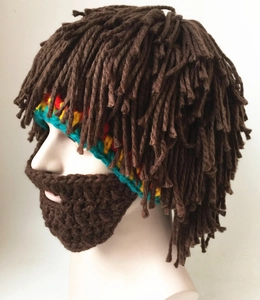 Detail of handmade knit Rasta hat with brown dreadlocks and long crochet beard mask