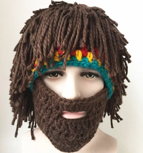 Detail of handmade crochet Rasta wig hat with brown knit beard and colorful stripes
