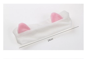 Detail view of 24cm white plush cat ear headband made of soft flannel material