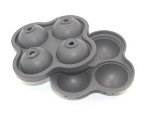 Detailed view of gray 4-cavity spherical silicone ice mold with split design