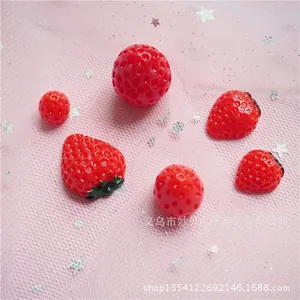 Red resin strawberry DIY accessories with heart shapes on pink glitter mesh background