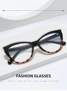Detail of cat-eye glasses frame featuring black and tortoiseshell splicing on a white pedestal