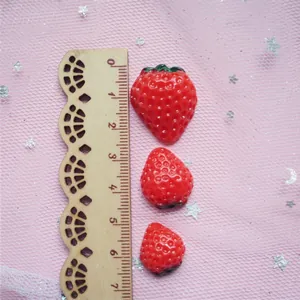 Red resin strawberry charms in three sizes for DIY crafts and phone case decorations