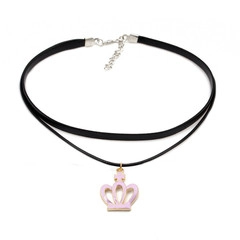 Close-up of double-layer velvet choker featuring a pink crown pendant and gold hardware