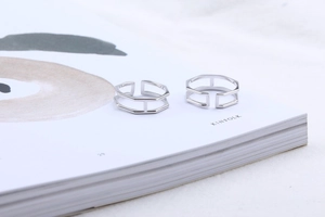Modern S925 sterling silver hexagonal open ring displayed on a minimalist magazine