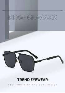 Close-up of square metal sunglasses with double bridge and dark grey lenses on grey stand