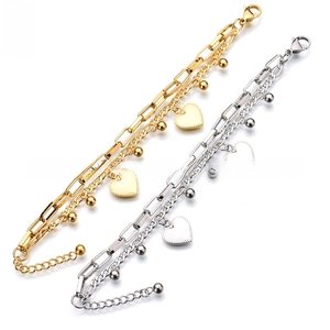 Detail of gold and silver heart pendant bracelets with rectangular links and lobster clasp