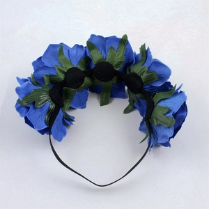 Detail view of the back construction for the blue rose headband with green leaf accents