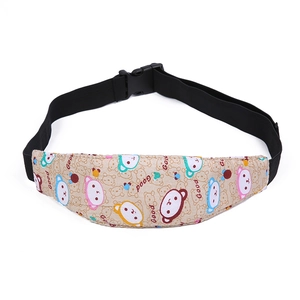Detail of baby stroller head support belt with cute cartoon bear and adjustable strap
