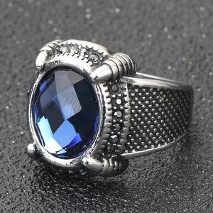 Vintage 18mm stainless steel signet ring featuring a large faceted blue sapphire gemstone