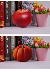 Detailed plush fruit coin purses featuring red apple and orange pumpkin with zippers