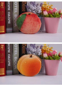 Detail of peach and yellow peach plush coin purses with zippers and metal chains