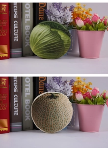 Detail of plush cabbage and melon coin purses with zippers and metallic ball chains