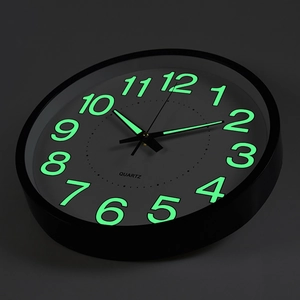 12-inch luminous wall clock with quartz movement and glowing numbers in dark