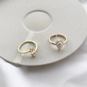 Detail of adjustable gold-plated S925 silver rings with geometric white inlay and zircon