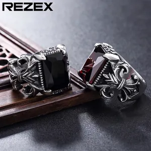 Gothic punk rings with red and black gemstones and intricate cross floral patterns