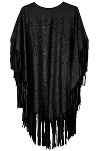 Detail of black faux suede poncho featuring intricate laser-cut leaf patterns and long fringe