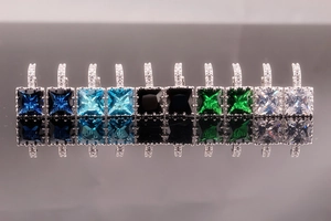 Macro detail of square cut zircon earrings in five colors with silver metal finish