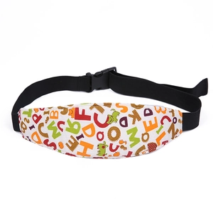 Detail of infant car seat head support strap with colorful alphabet patterns and adjustable buckle
