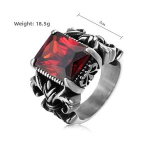 Macro shot of vintage steel ring with a large red ruby and intricate carvings, weight 18.5g