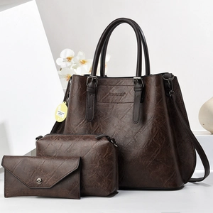 Three-piece dark brown faux leather tote set including handbag, clutch and wallet