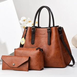 Three-piece brown PU leather bag set featuring tote bag, pouch and wallet on white background