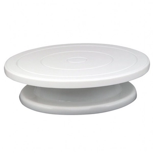 Detail of white PP plastic cake turntable with non-slip concentric textures and stable base