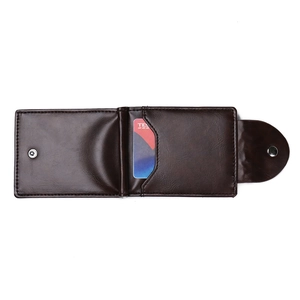 Detail view of dark brown leather wallet with card slots and double snap buttons