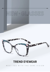 Macro detail of cat eye TR90 glasses frame showing marble texture and colorful accents