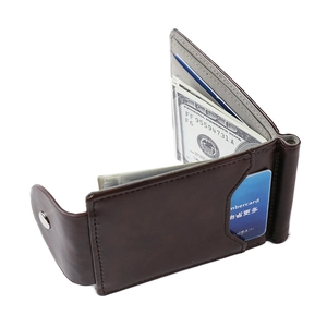 Detailed interior of dark brown leather wallet showing card slots and metal money clip