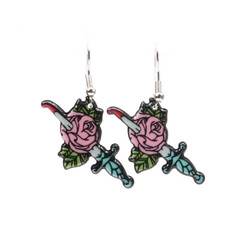 Detail shot of vintage tattoo style rose and dagger earrings with silver hooks